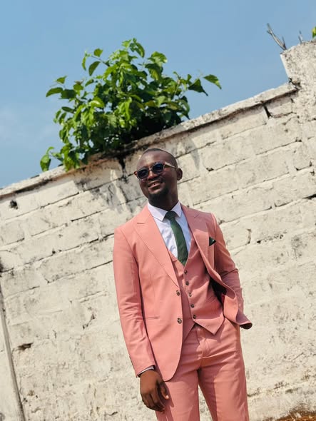 Man in a slim salmon three-piece suit — Marks Clothing
